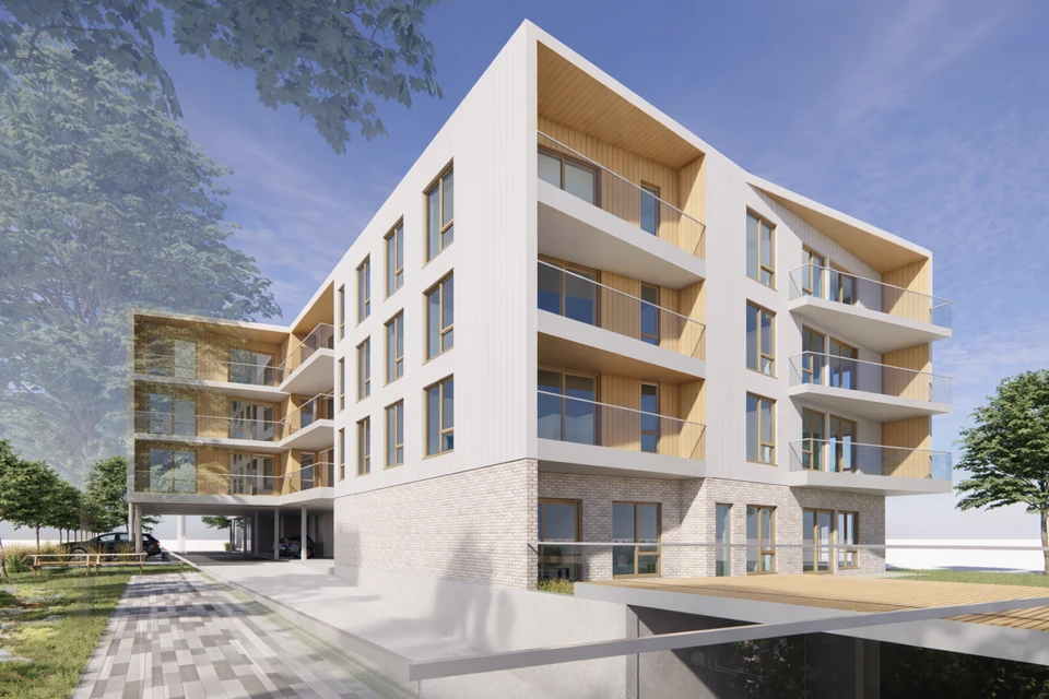 Vue extérieure de Trait-Carré, façade blanche et balcons en bois