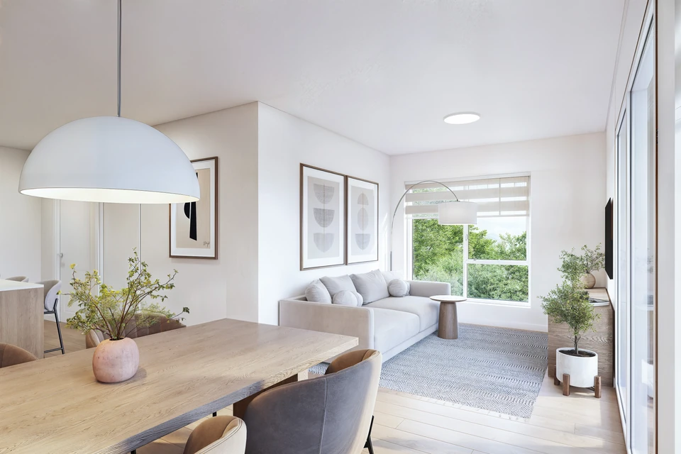 Salle à manger lumineuse avec vue sur le salon